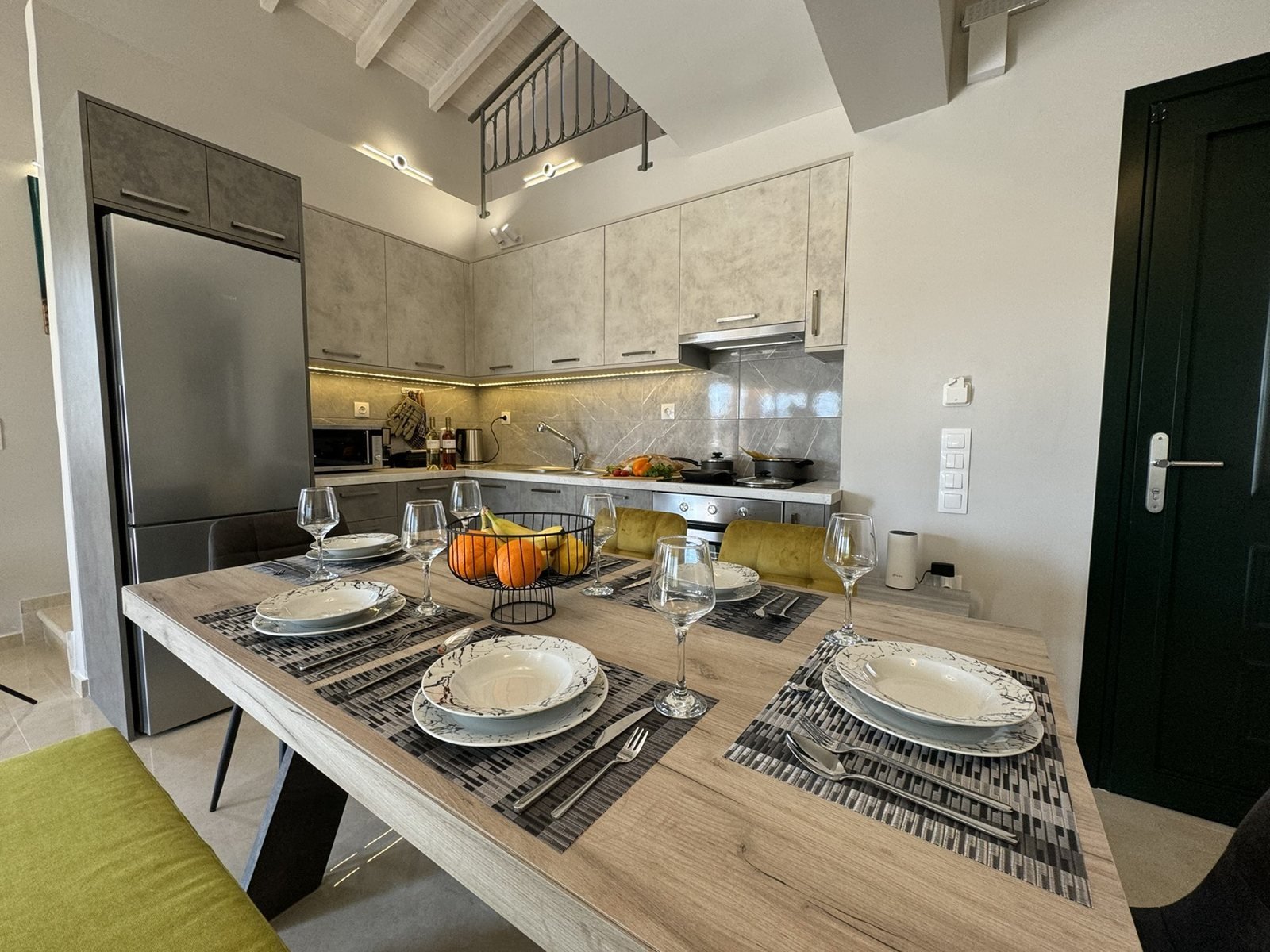 Fully equipped modern kitchen and dining table at Castelia Luxury Villas, Corfu