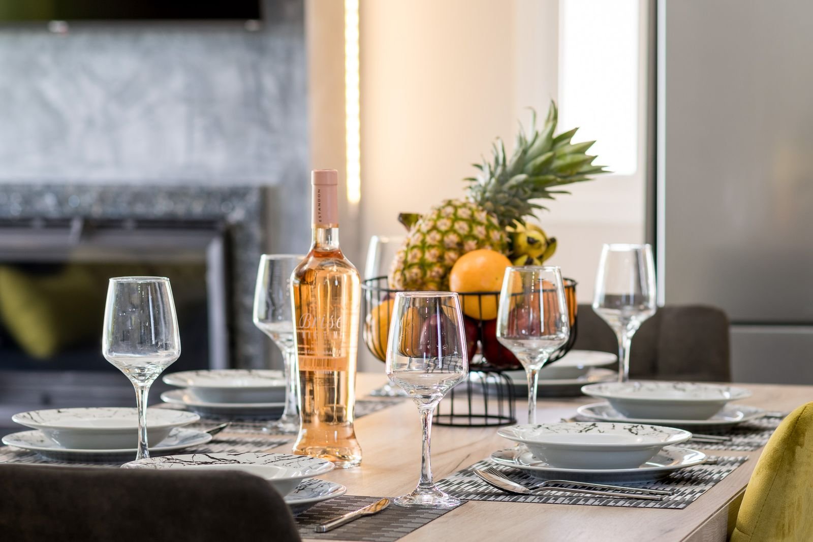 Dining table set with wine and fruit at Villa Pisti, Castelia, Corfu