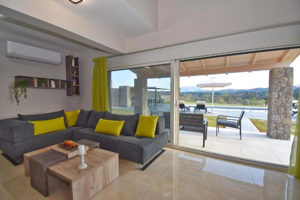 Bright lounge with air-conditioning and pool view at Villa Elpida, Castelia, Corfu
